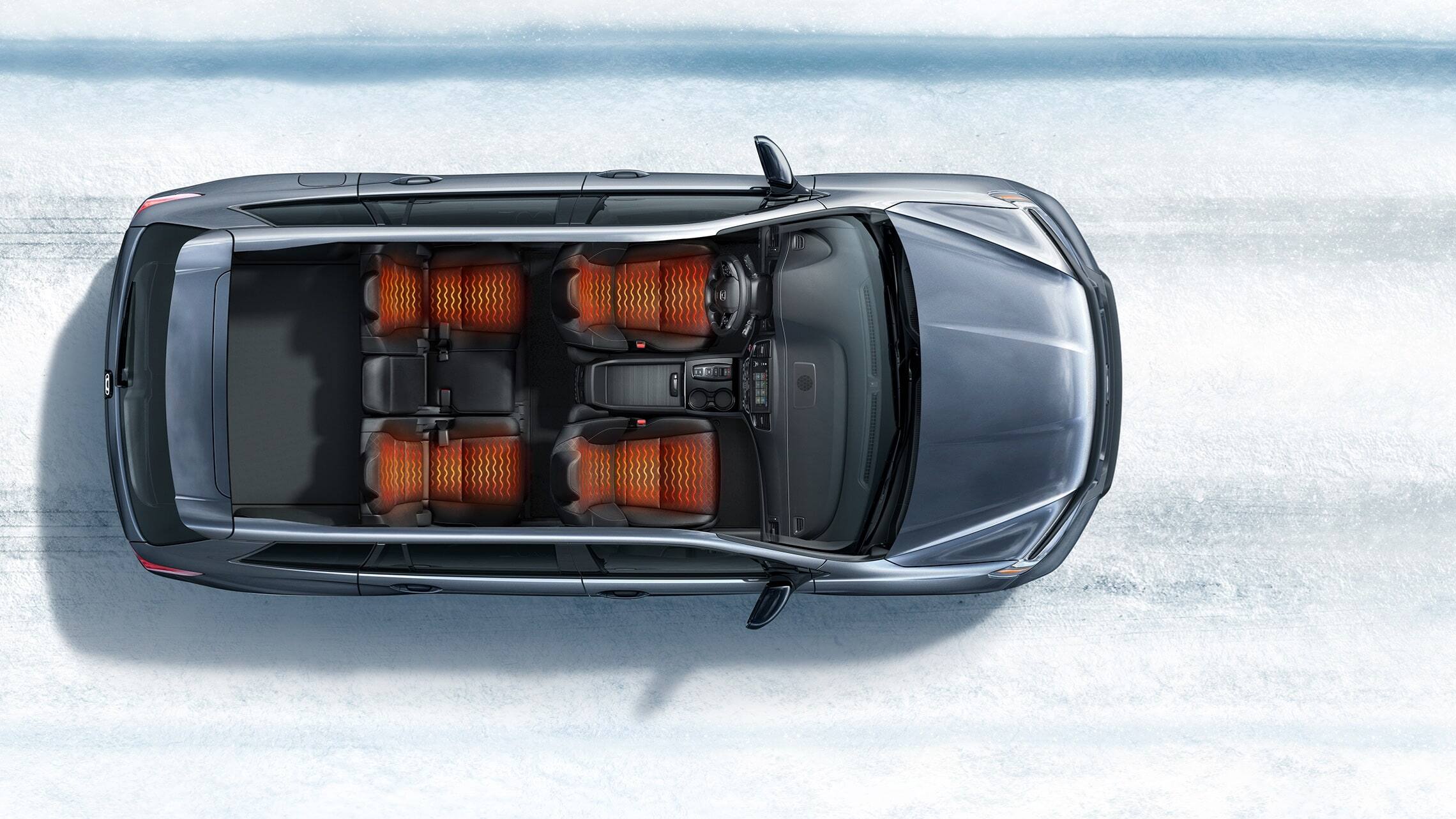 Overhead view of 2019 Honda Passport Elite demonstrating heated seats in a snowy road environment.