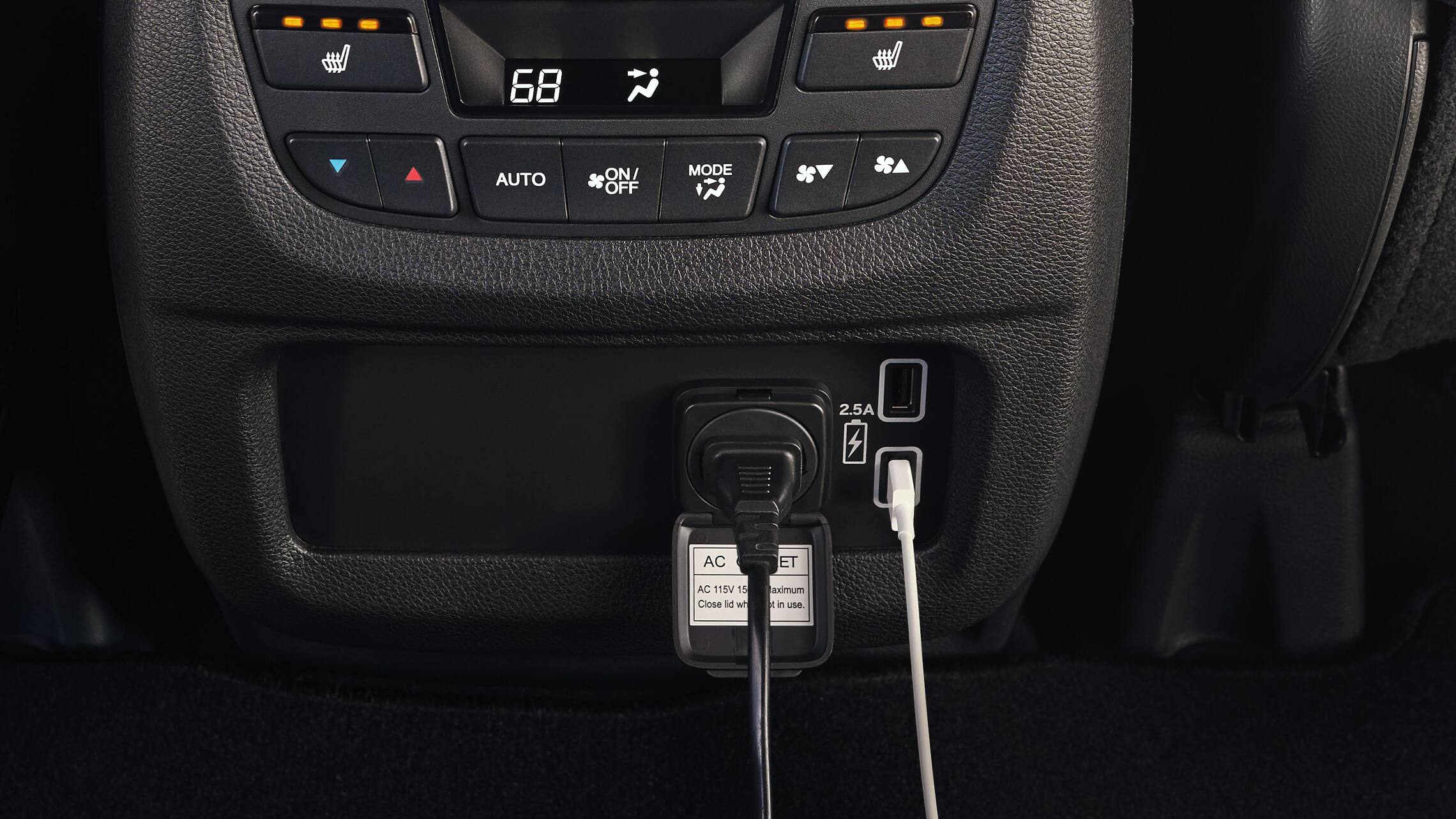 Interior view of 180-watt max power/120-volt AC power detail on the 2019 Honda Passport.
