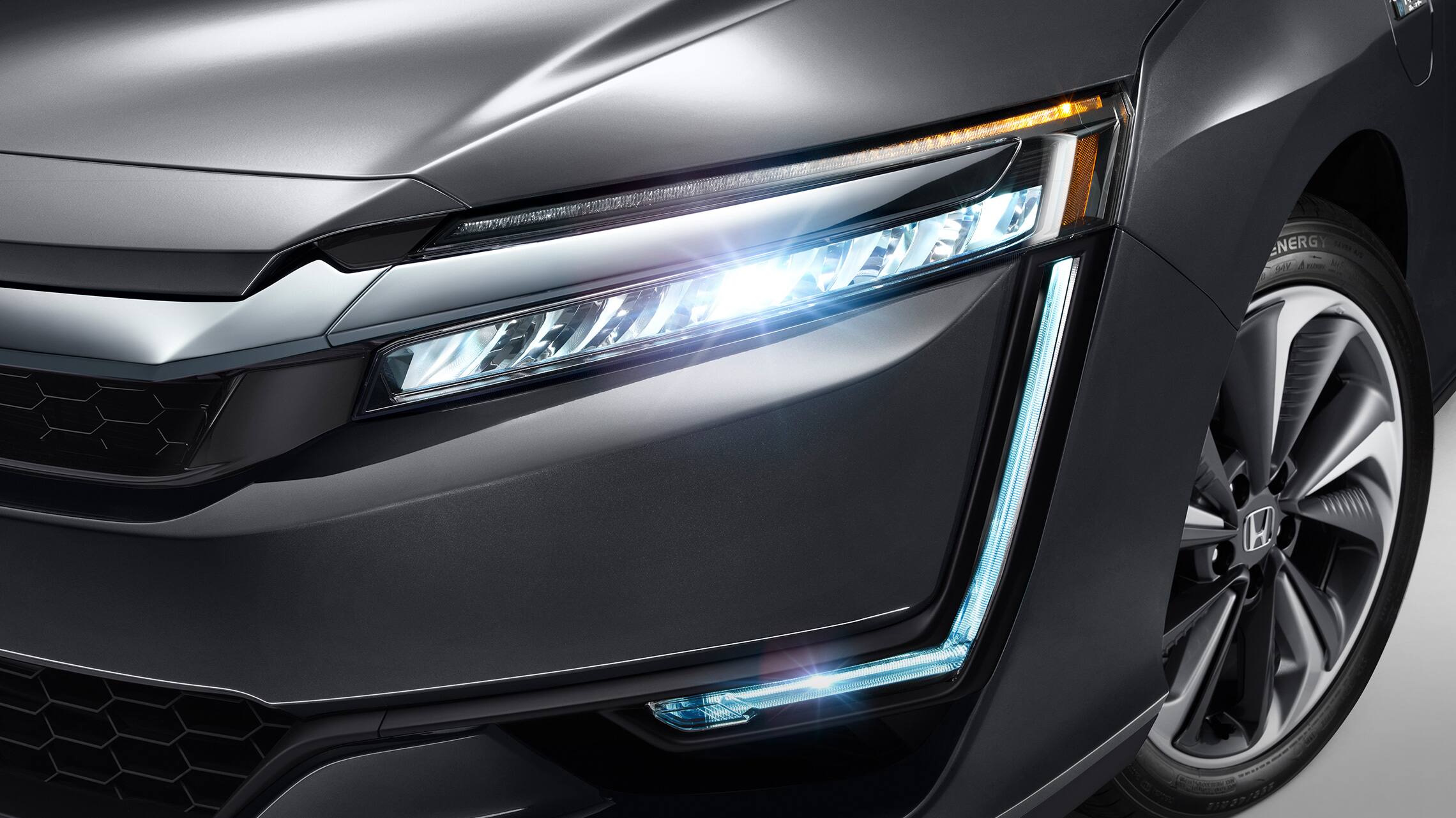 Detail of full LED headlights and DRL on 2021 Clarity Plug-In Hybrid in Modern Steel Metallic.